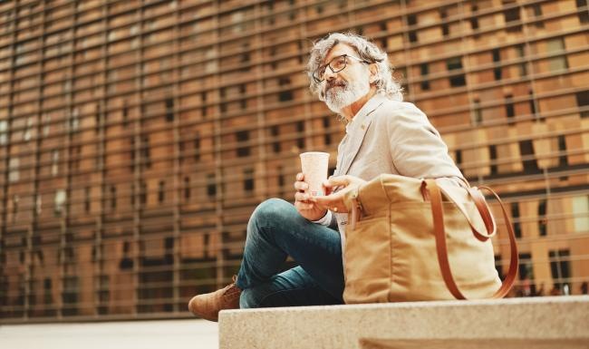a person sitting on a ledge