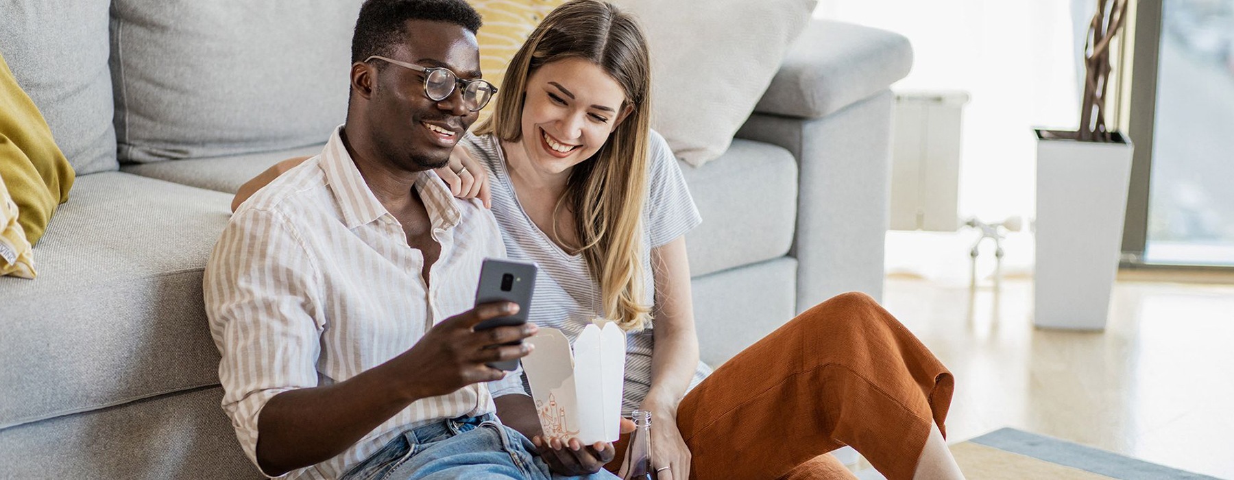 man and woman on cell phone